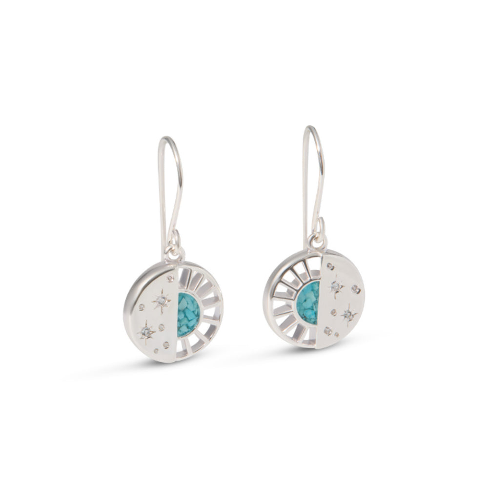 Silver earrings with turquoise stones on a white background