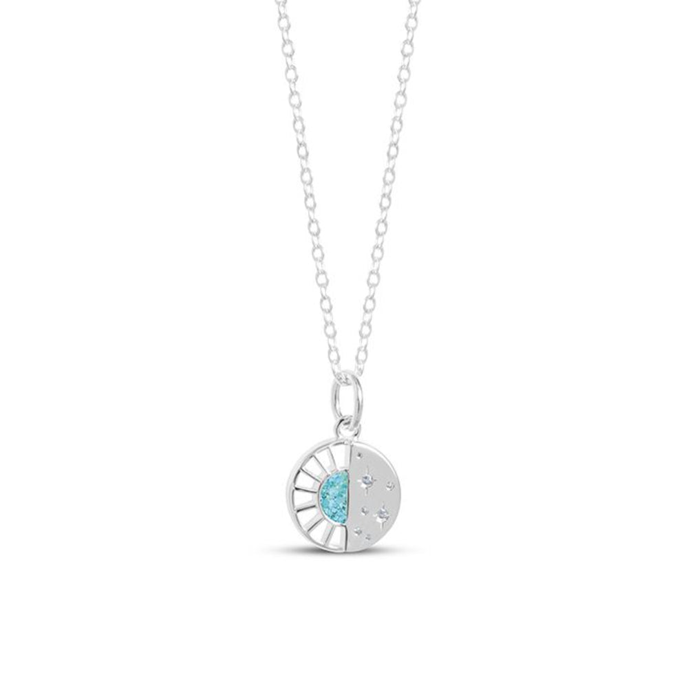 Silver necklace with a round pendant featuring a blue gemstone on a white background