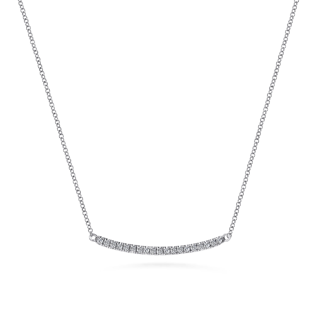 silver necklace with clear stones on white background