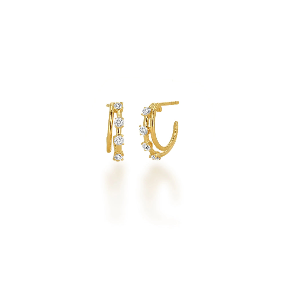 gold hoop earrings with clear stones on a white background