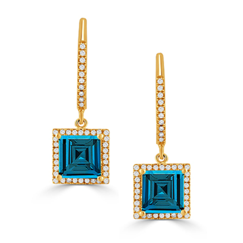 gold tone earrings with blue stones and clear stones on a white background