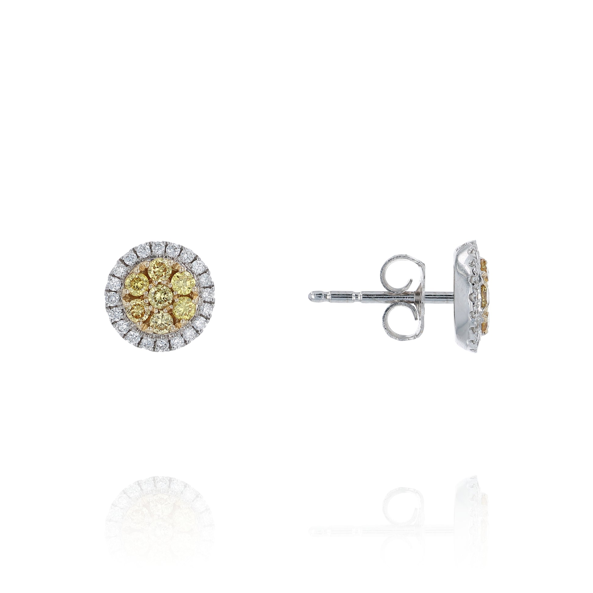 White gold stud earrings with yellow and white diamond clusters on a white background