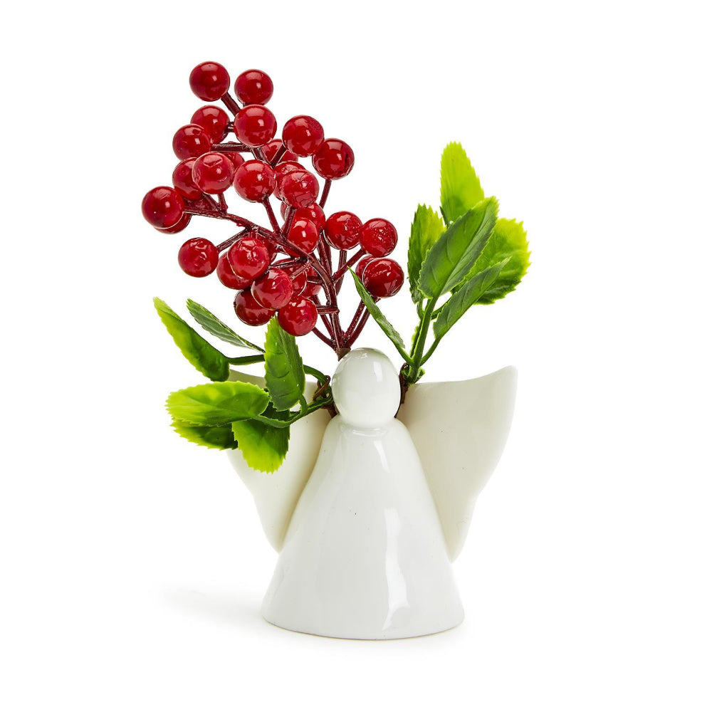 White ceramic decorative angel that can be used as a vase or candle holder with holly on a white backround.