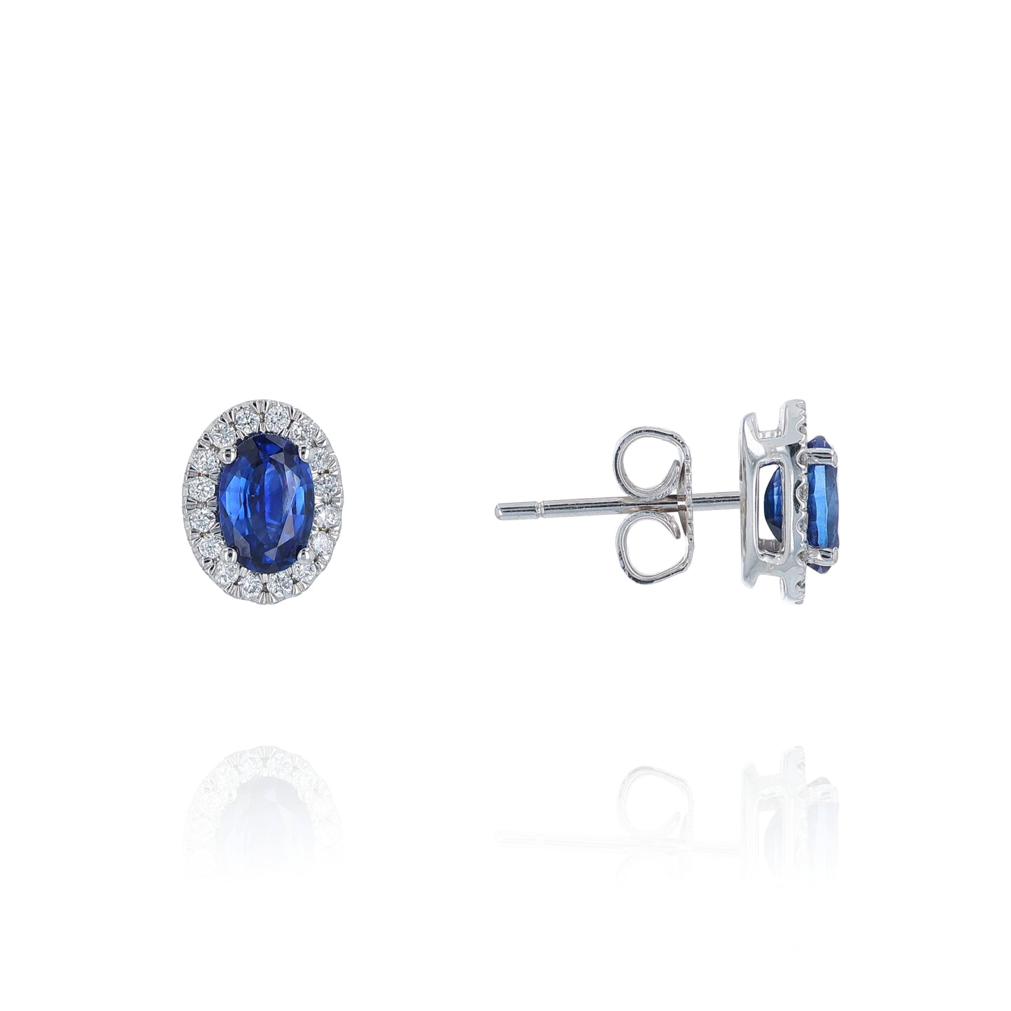 Pair of sapphire and diamond halo stud earrings on a white background
