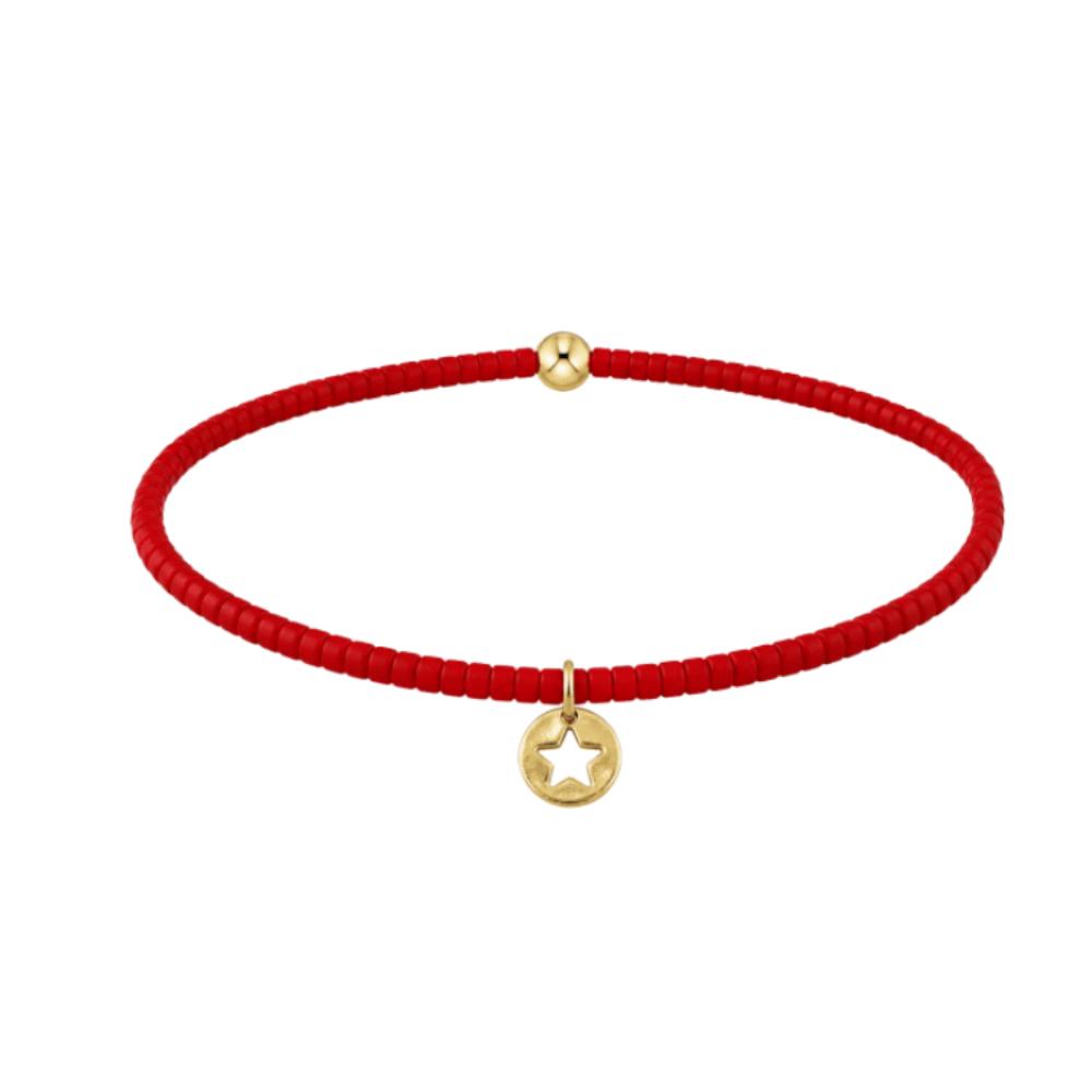 Red beaded bracelet with gold star disc on a white background