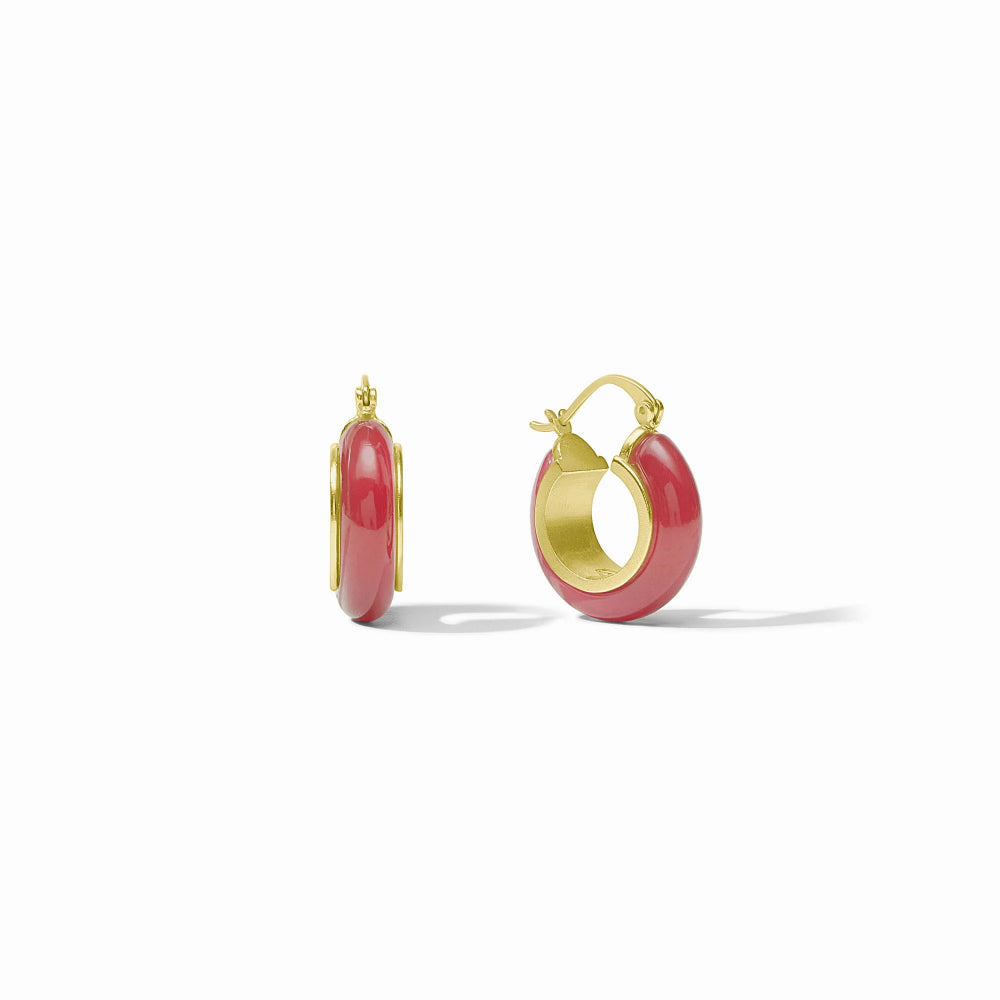 Gold hoop earrings with red stones on a white background
