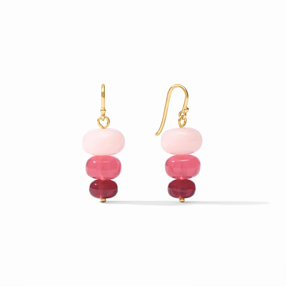 Pair of earrings with pink and red beads on a white background