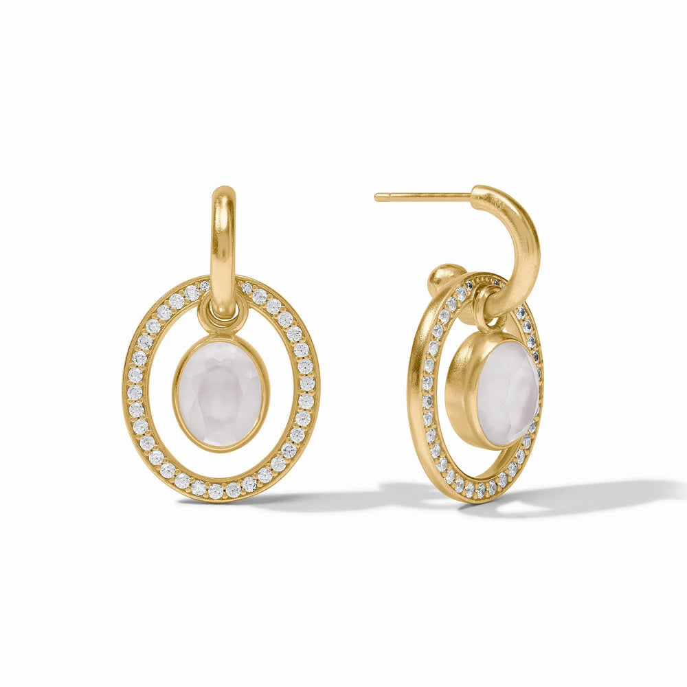 Gold hoop earrings with white stones and clear gemstones on a white background