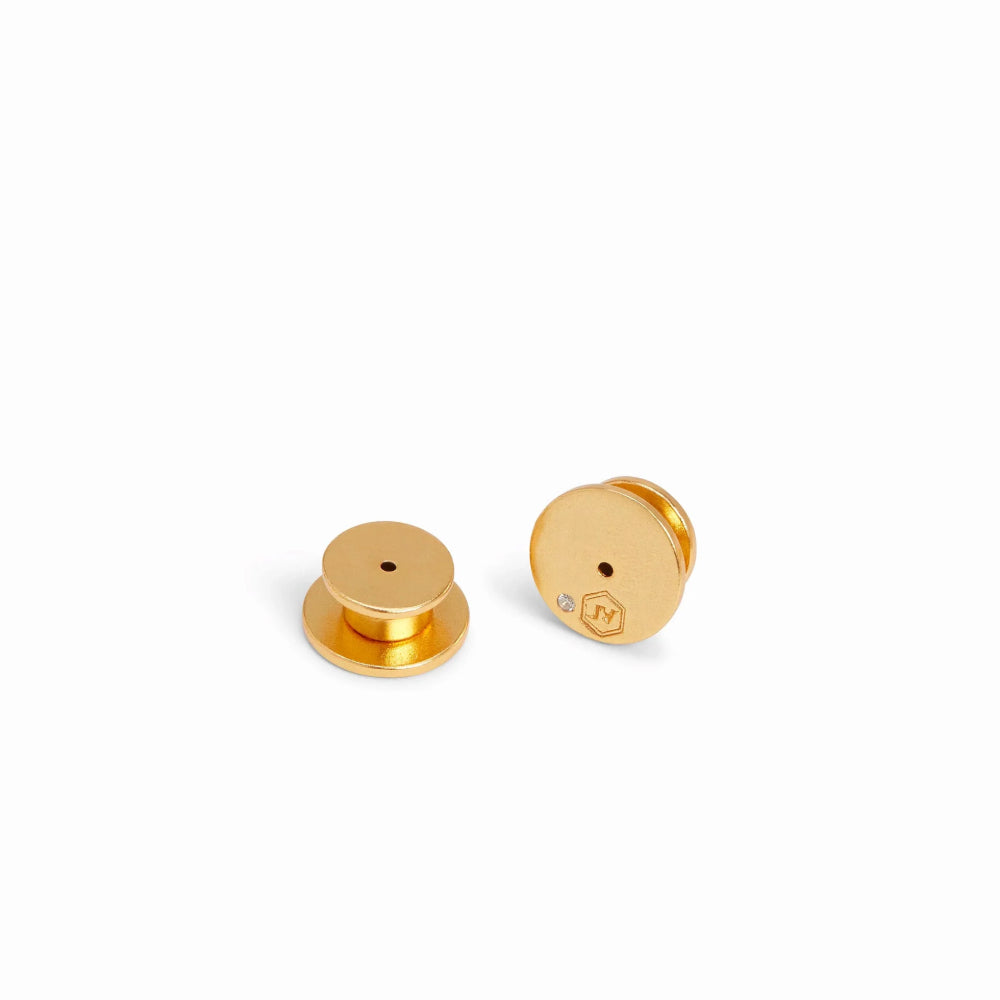 Gold earrings on a white background