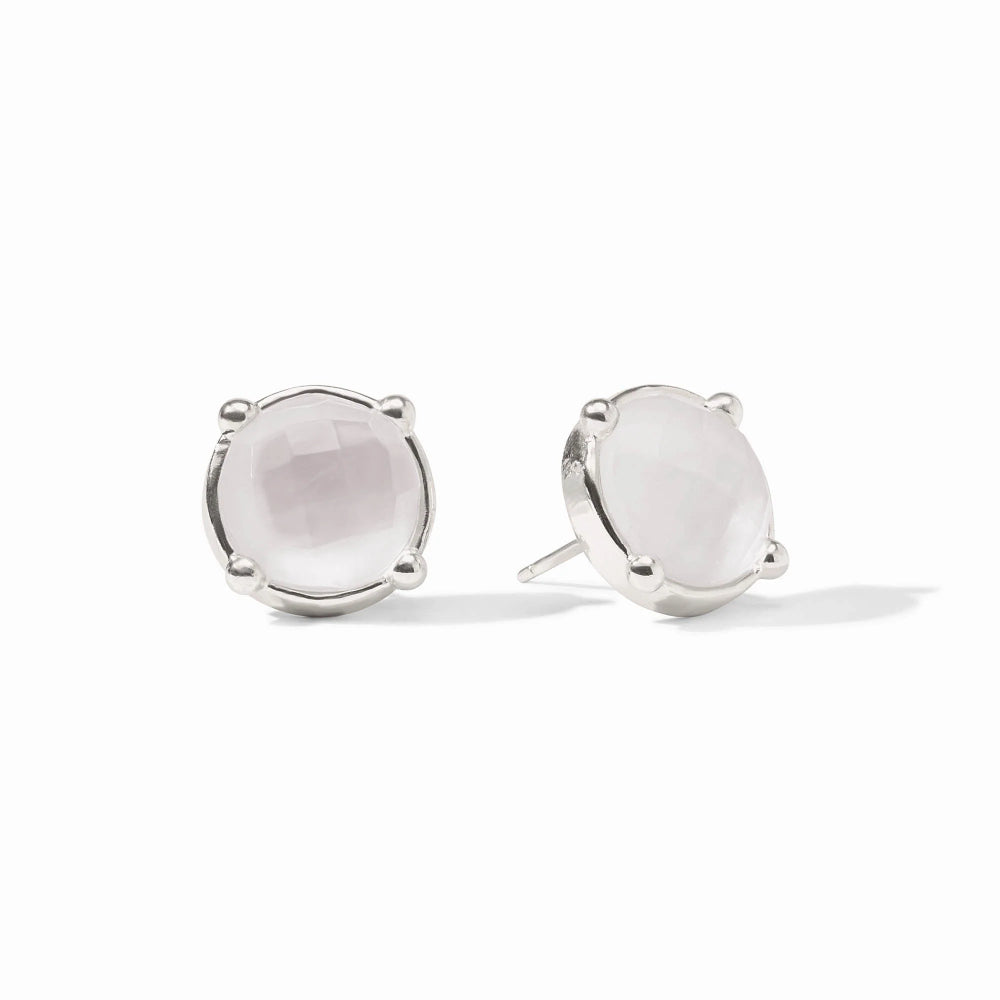 Pair of silver earrings with pink gemstones on a white background