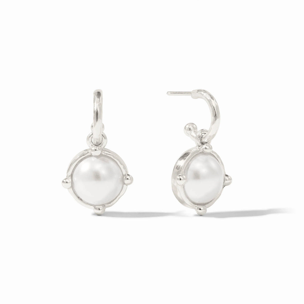 Pair of silver earrings with round white gemstones on a white background