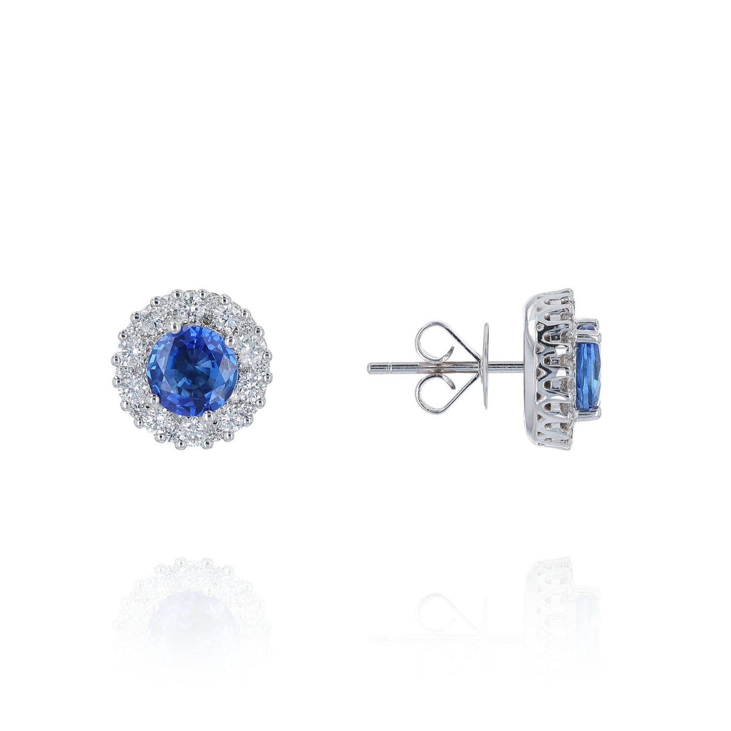 White gold round sapphire and diamond halo stud earrings on a white background