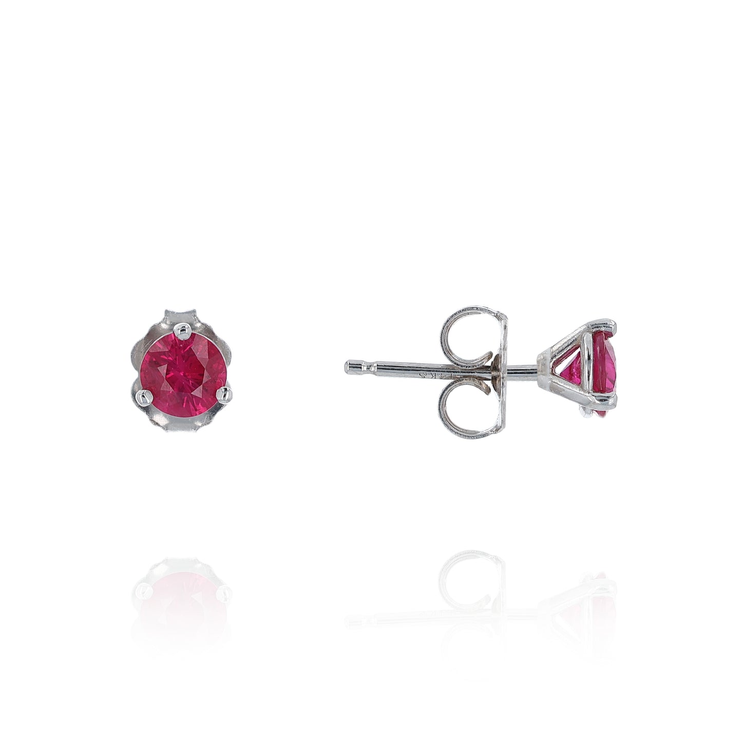 White gold round ruby martini stud earrings on a white background