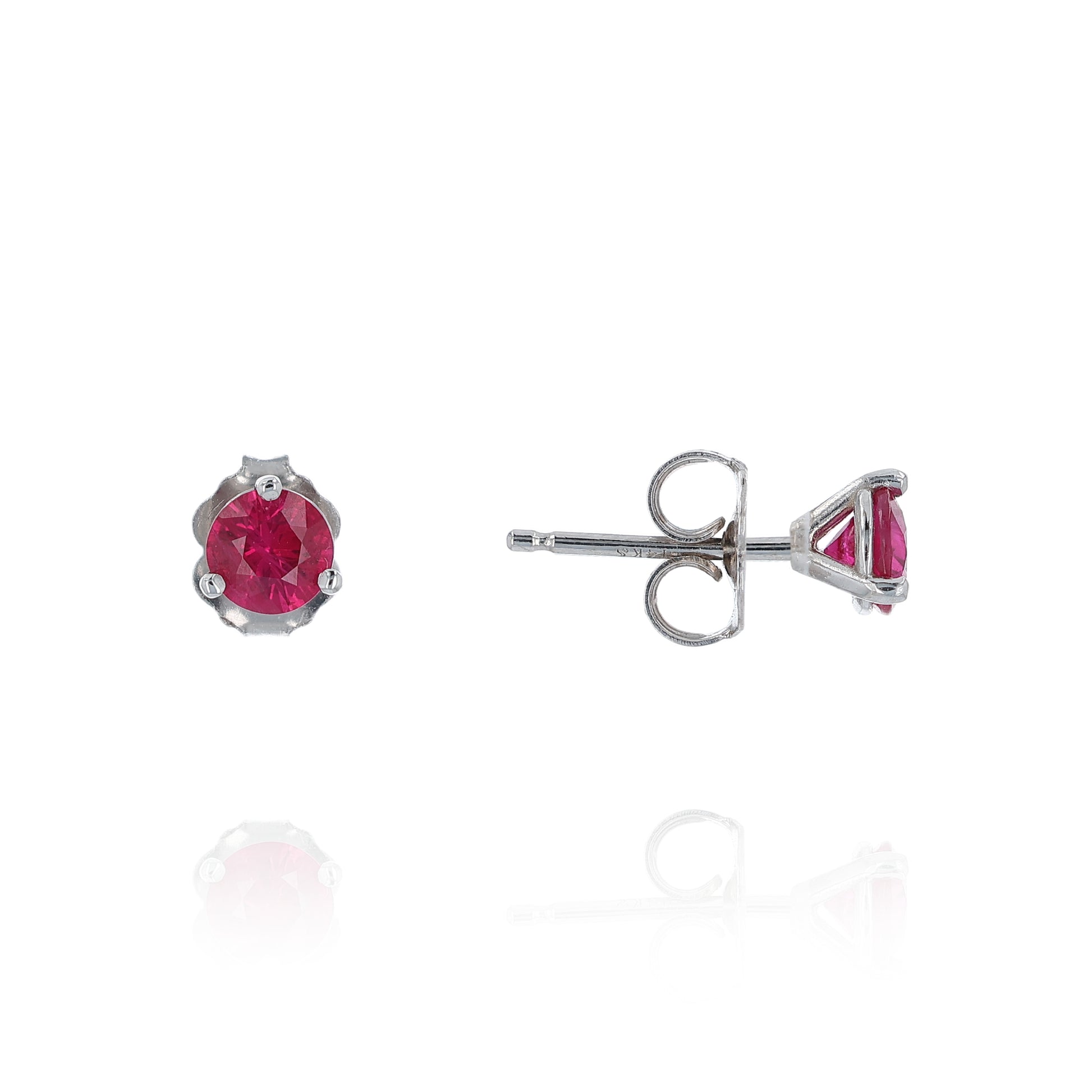 White gold round ruby martini stud earrings on a white background