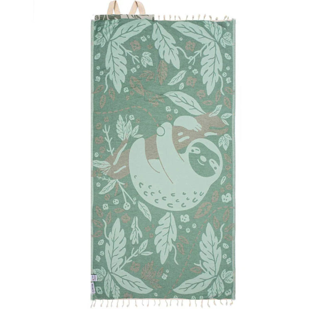 Green beach towel with sloth and leaf pattern on a white background.