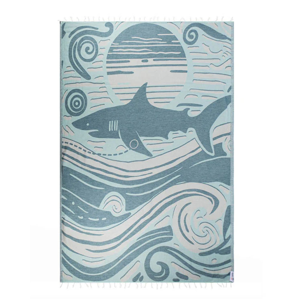 Blue Shark-themed beach towel with wave design on a white background.