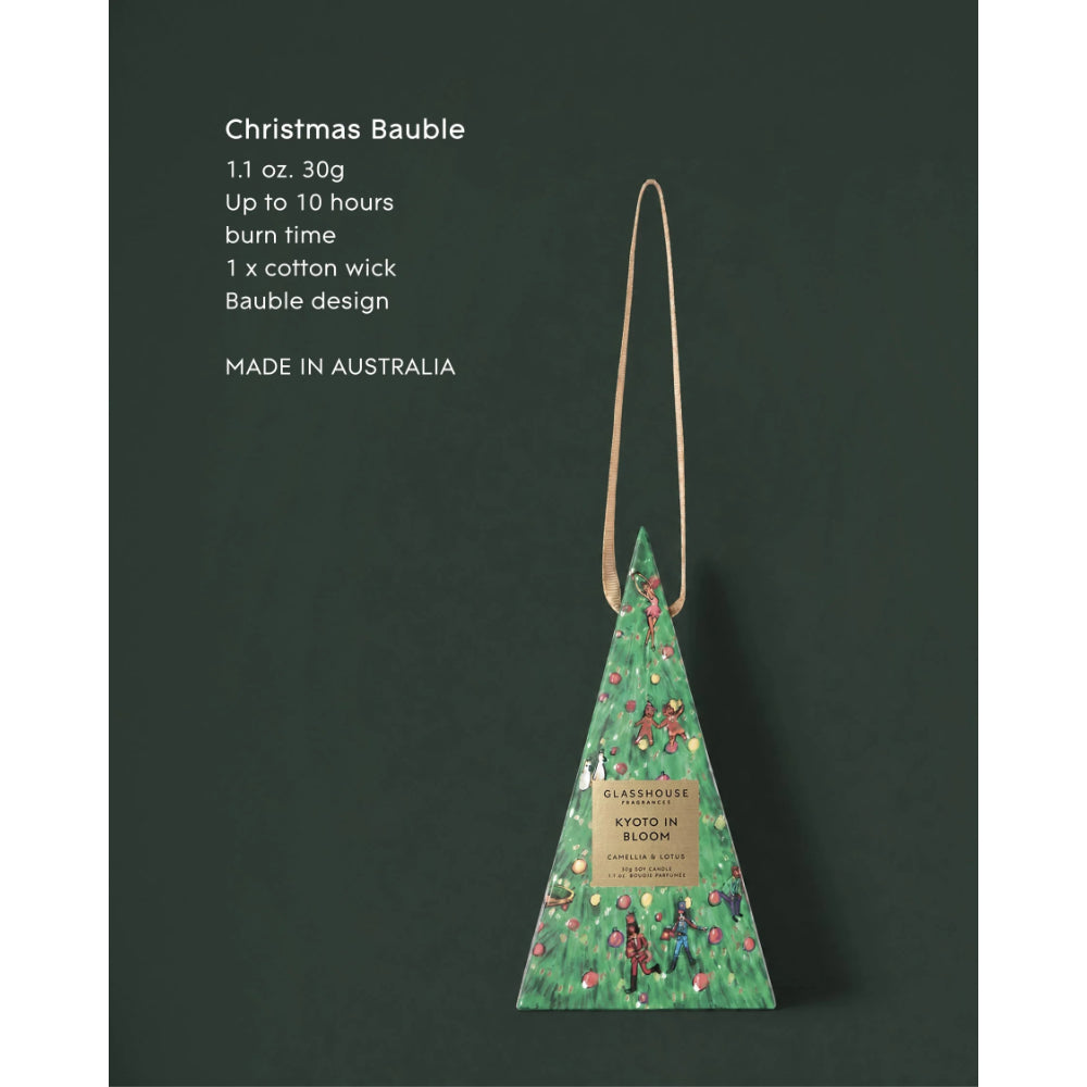 A Christmas Bauble shaped triangular incense holder with a green forest illustration and a light tan hanging loop, shown against a dark green background with product text on the left.