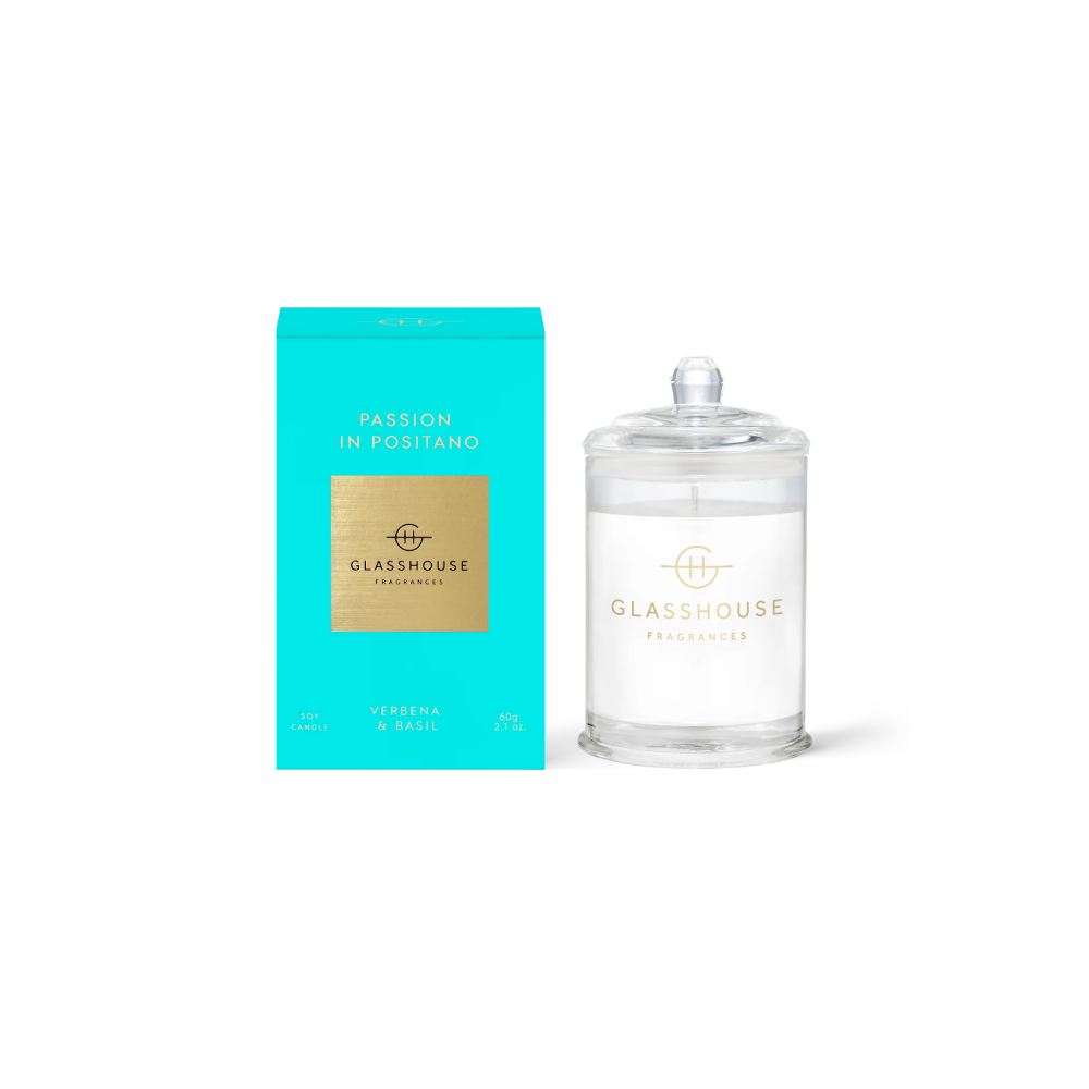 Glasshouse candle and teal packaging  with clear " Passion In Positano" candle on a white background.