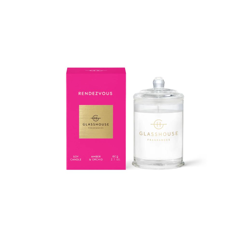 Glasshouse candle and pink packaging with clear 'Rendezvous' candle on a white background.