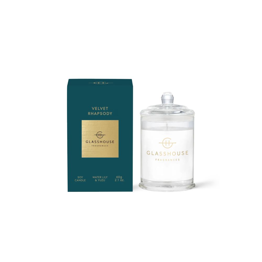 Glasshouse candle "Velvet Rhapsody" and green packaging on a white background.