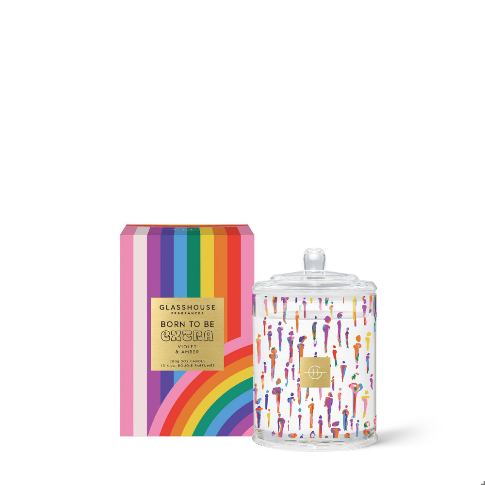A Glasshouse Fragrance Candle with colorful designs and colorful box on white background. 