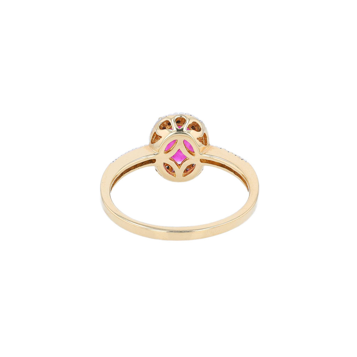 Yellow gold ruby and diamond halo ring on a white background