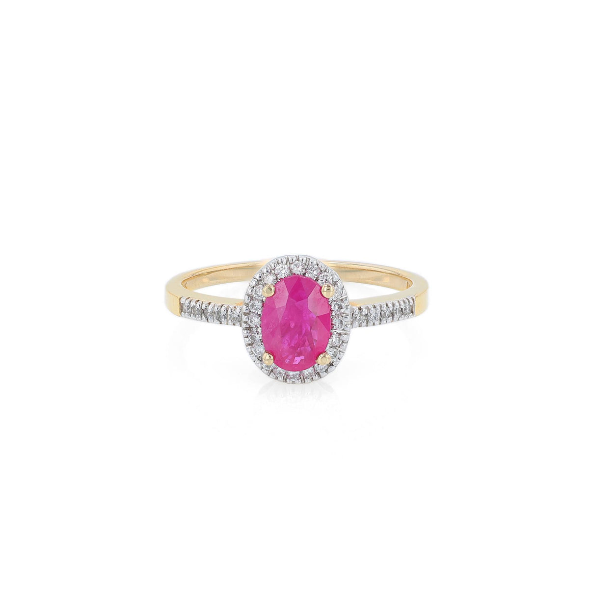 Yellow gold ruby and diamond halo ring on a white background
