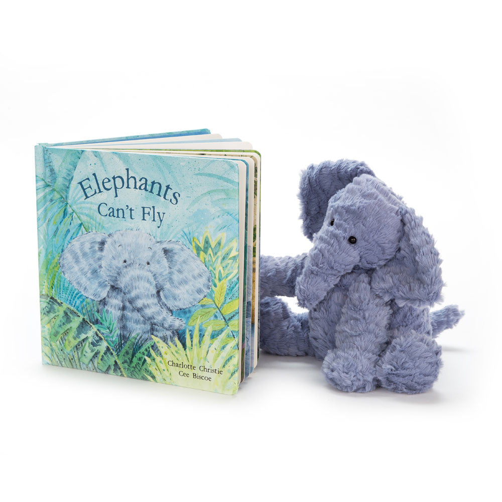 Children's book titled 'Elephants Can't Fly' with a blue plush elephant toy on a white background