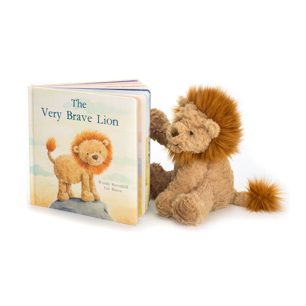 Beige medium stuffed lion toy next to a book titled 'The Very Brave Lion' on a white background