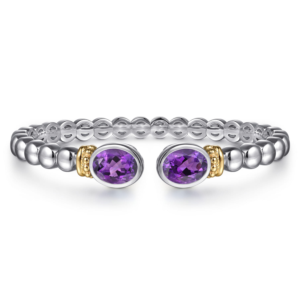 Silver beaded bracelet with purple gemstones on a white background