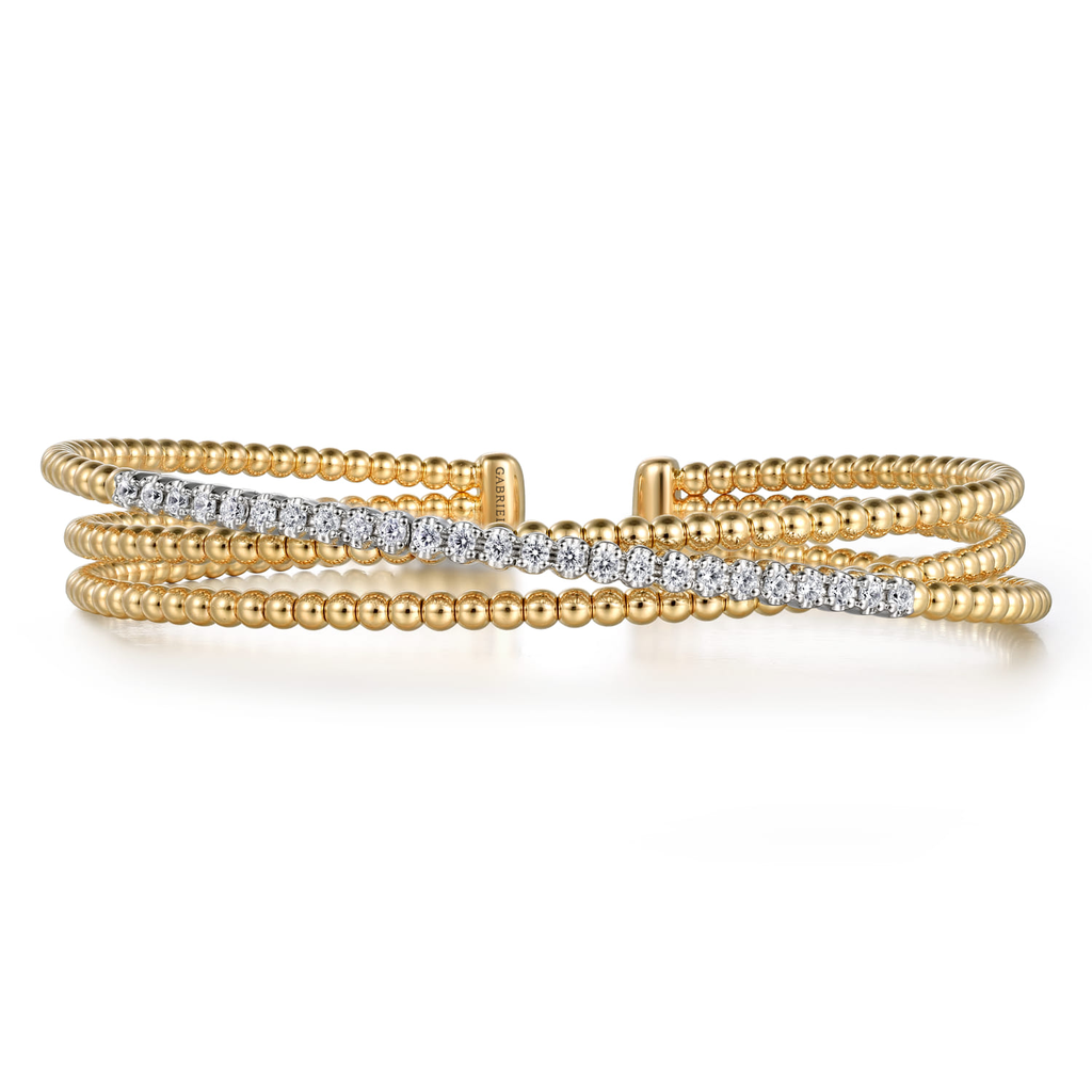 gold and silver wrap beaded bracelet with clear stones on white background