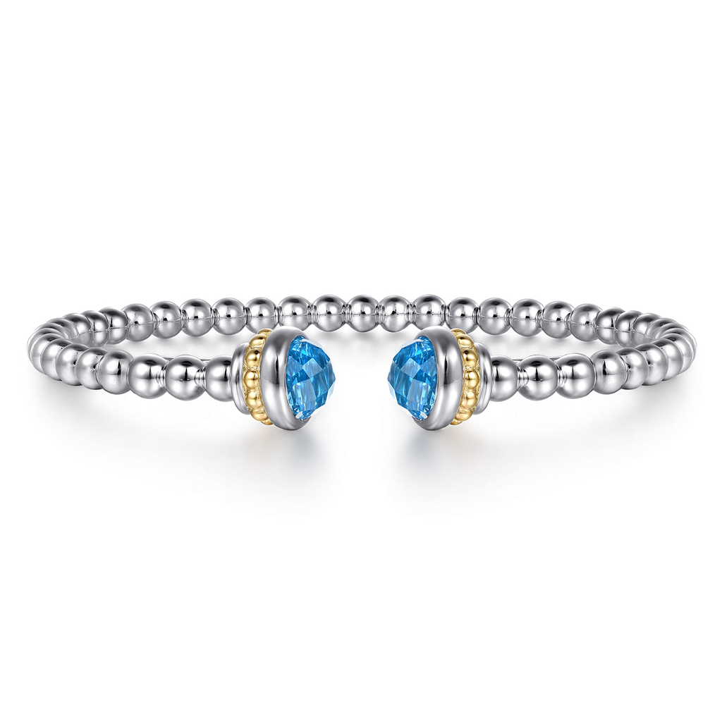 Silver bracelet with blue gemstones on a white background