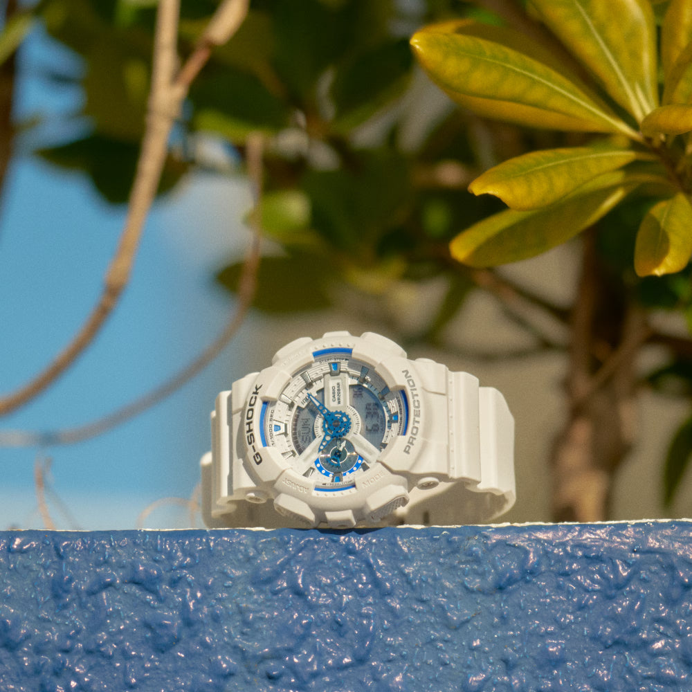 White watch with a beachy background