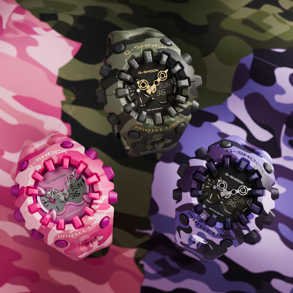 Three colorful G-Shock watches on a multicolored camouflage background