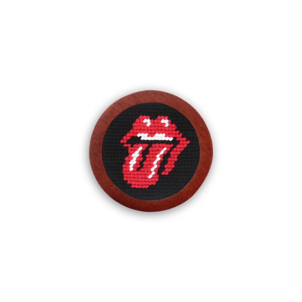 A circular embroidered patch featuring the red and white Rolling Stones tongue and lips logo on a black background, surrounded by a brown wooden border, shown against a plain white background.
