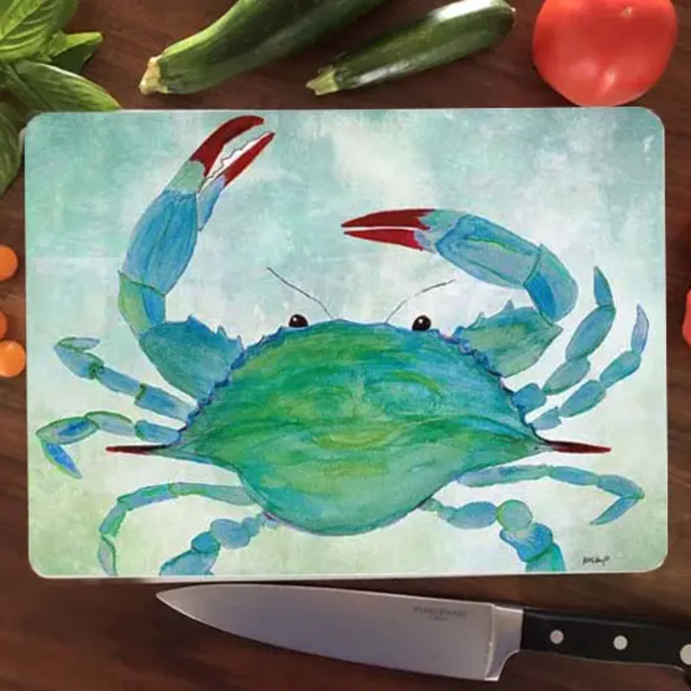 CUTTING BOARD with a blue crab design on a wooden surface with vegetables.