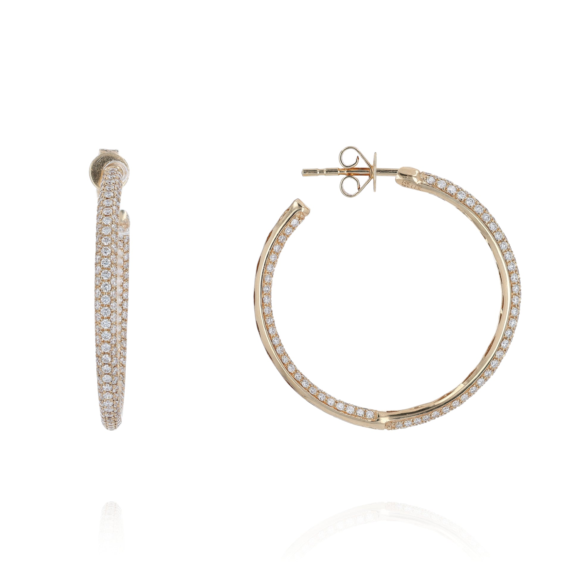 Yellow gold inside & out pave diamond hoop earrings on a white background