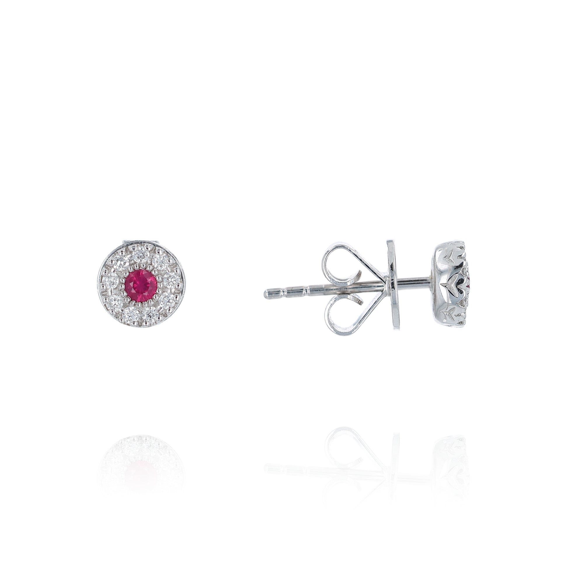 White gold round ruby and diamond halo stud earrings on a white background