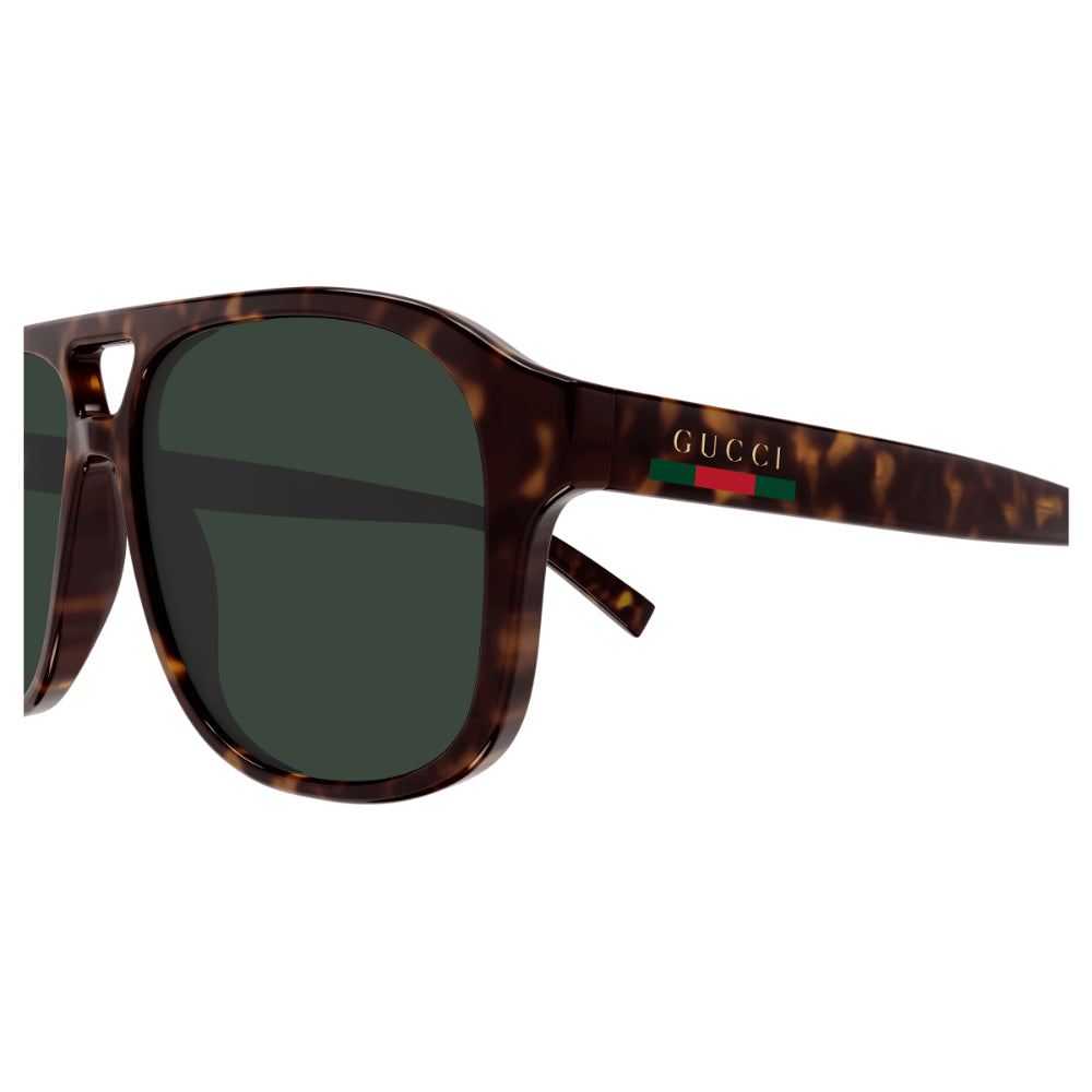 Gucci sunglasses with tortoiseshell frame and green lenses on a white background