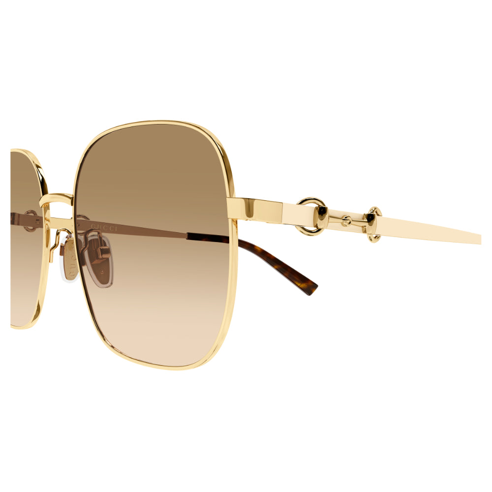 Gold square sunglasses with gradient brown lenses and a horsebit detail on the temple arm, shown against a plain white background.