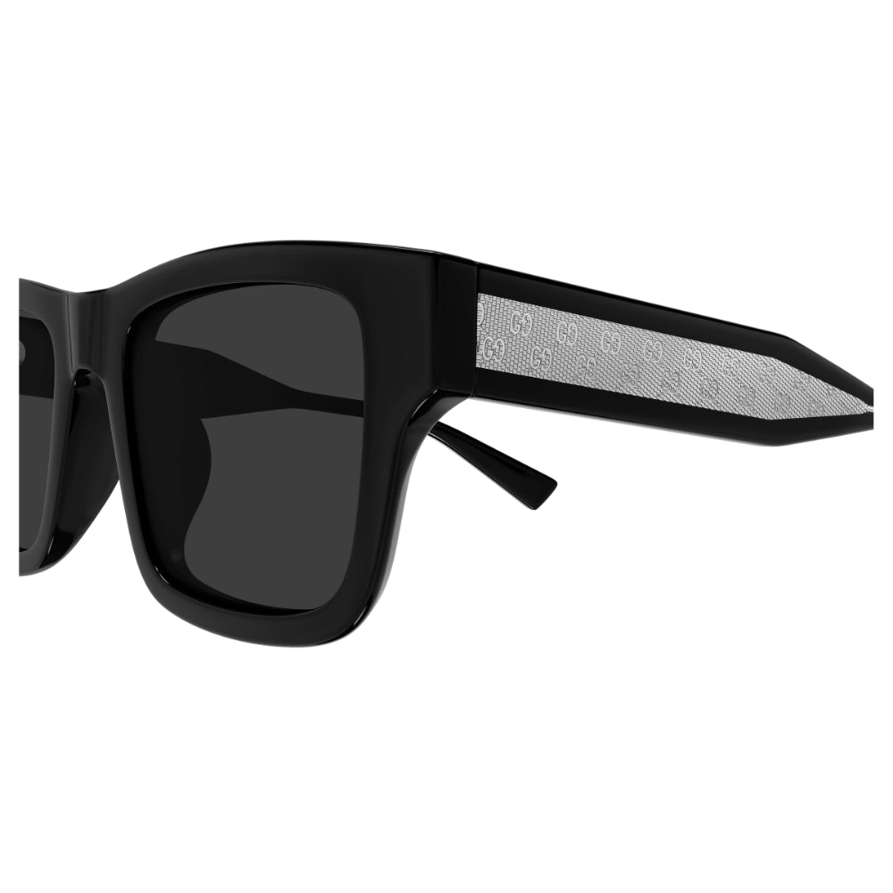 Black sunglasses with a textured side panel on a white background