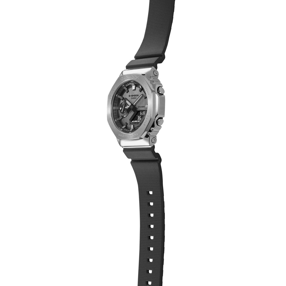 Watch with black strap and silver case on a white background