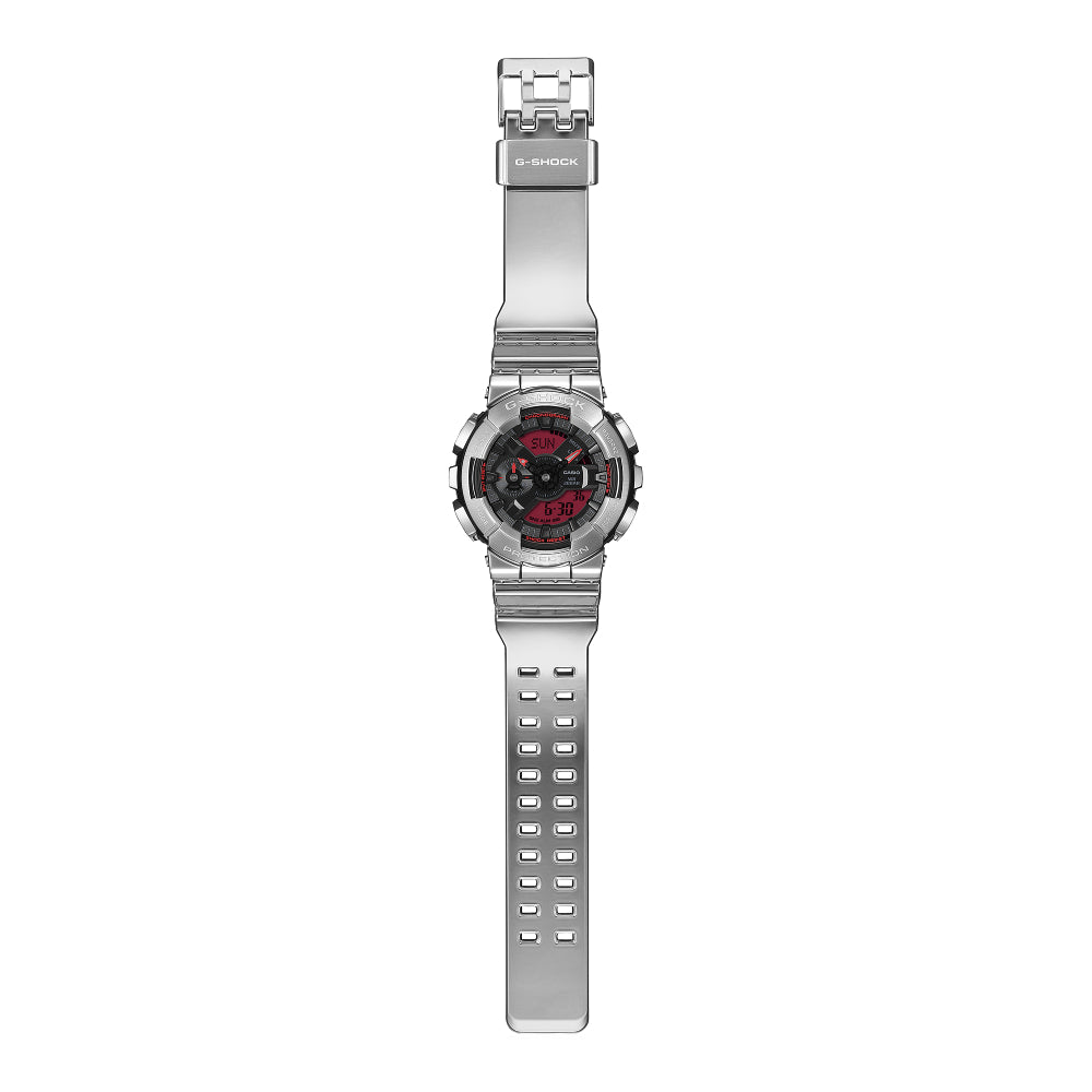 Silver G-Shock watch with a red analog/digital dial on a white background
