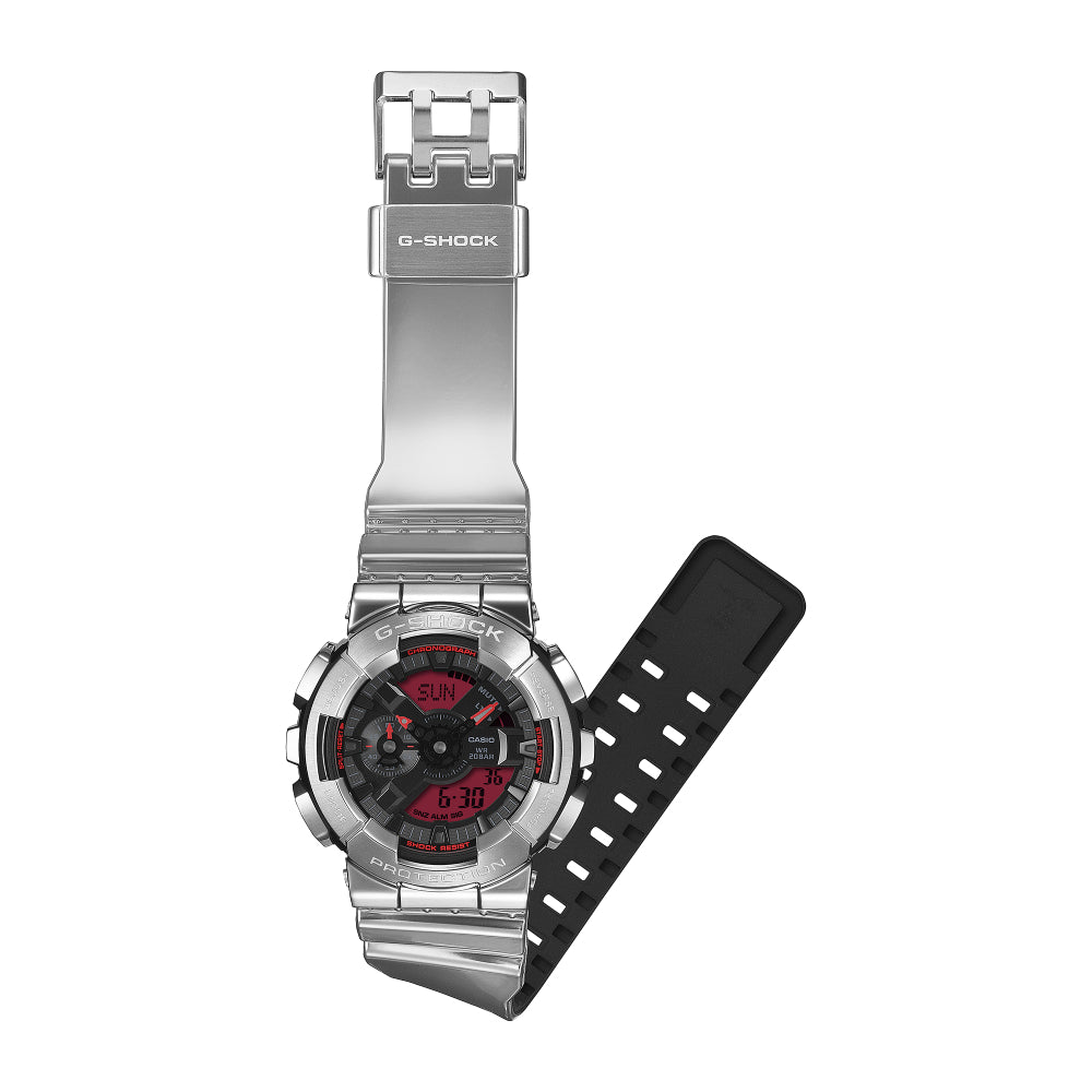 Silver G-Shock watch with a red analog/digital dial on a white background