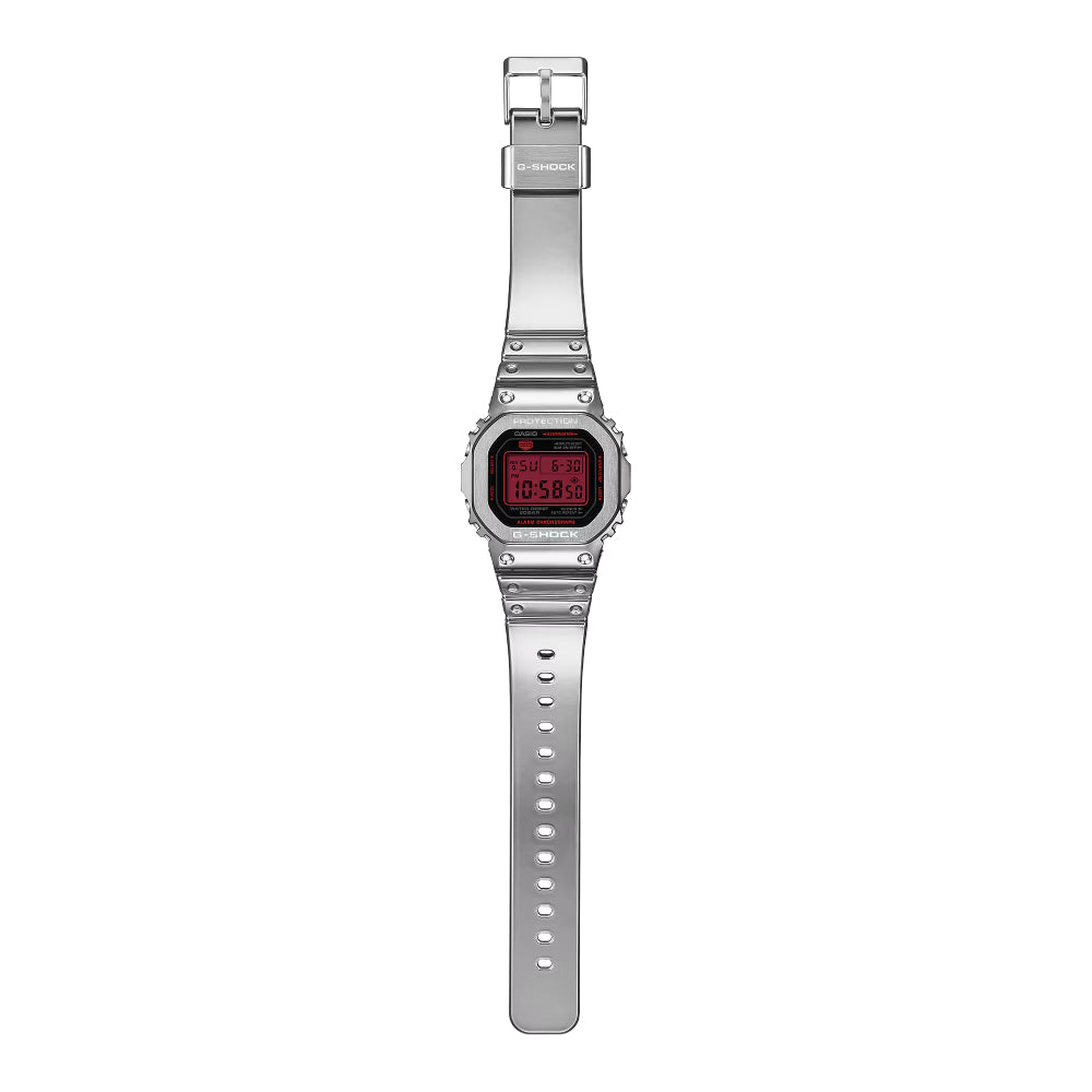 Silver G-Shock watch with a red digital dial on a white background
