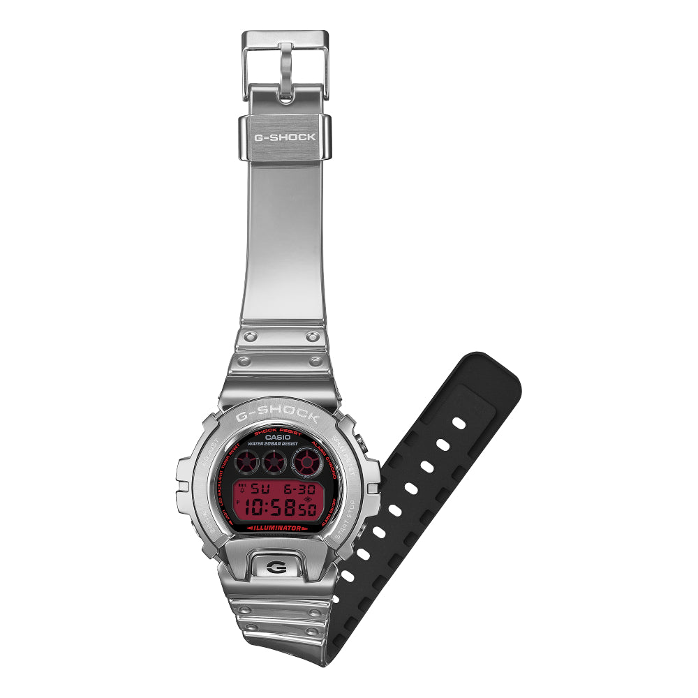 Silver G-Shock watch with a red analog/digital dial on a white background