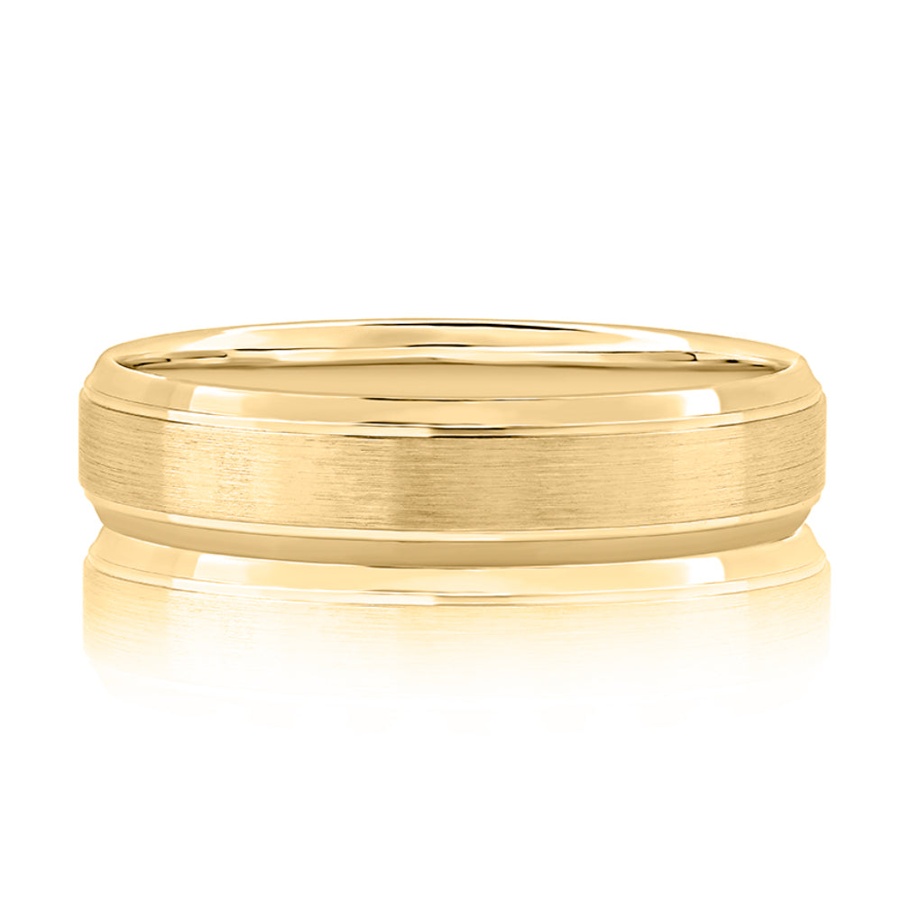 Gold ring with a reflective surface on a white background