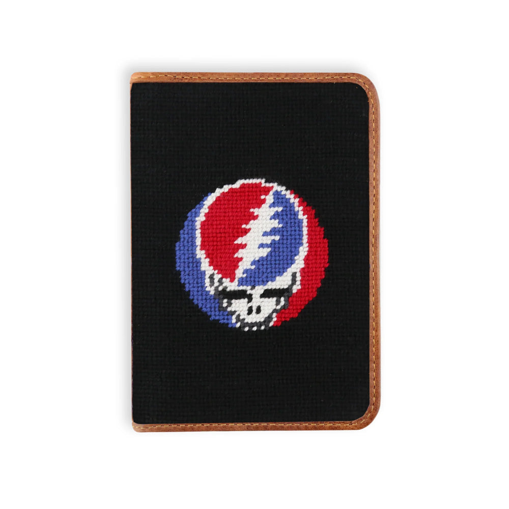 A black needlepoint golf scorecard cover featuring a Steady Grateful Dead skull logo in the center, finished with a brown leather border on a white background.