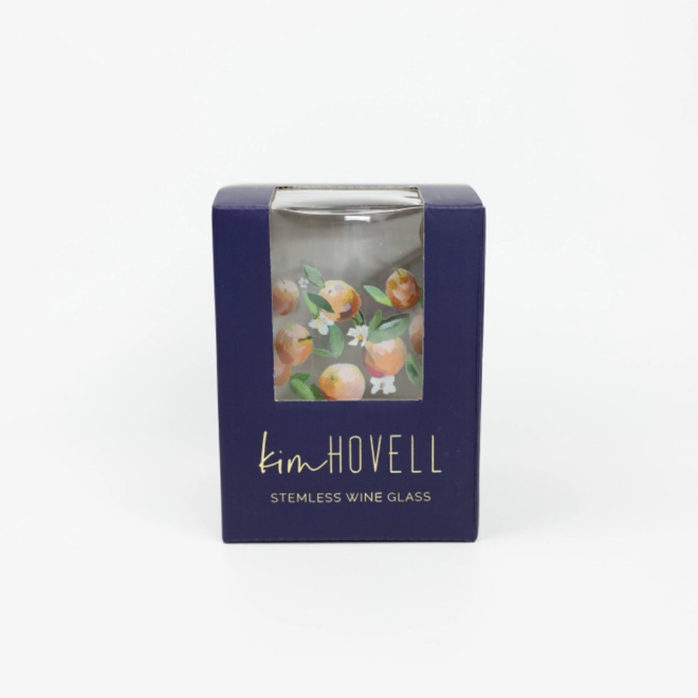 Kim Howell stemless wine glass packaging with a blue box and decorative label on a white background