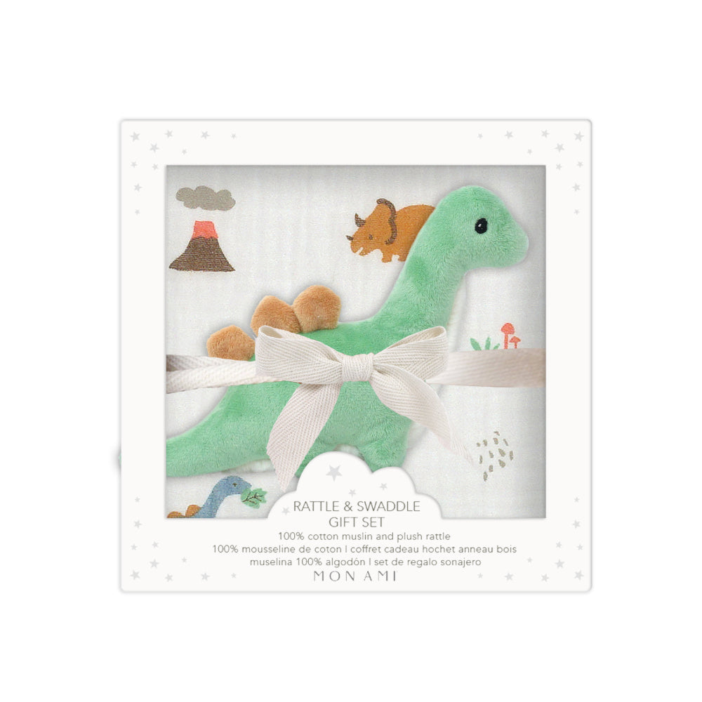 Dinosaur-themed baby gift set with green dinosaur plush toy and matching blanket on a white background